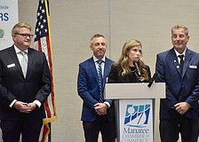 Manatee County administrators address the Manatee Chamber of Commerce Dec. 8. From left to right: Deputy county administrators Corey Stutte, Bryan Parnell, Courtney De Pol and County Administrator Charlie Bishop.