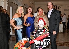 The World of Chucko photo-bombs Dana Dalpra, Lauren Hersh and Tami and Phillip Lanham.