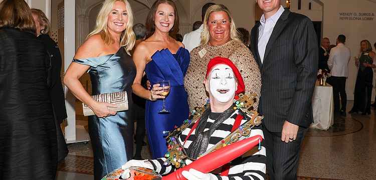 The World of Chucko photo-bombs Dana Dalpra, Lauren Hersh and Tami and Phillip Lanham.