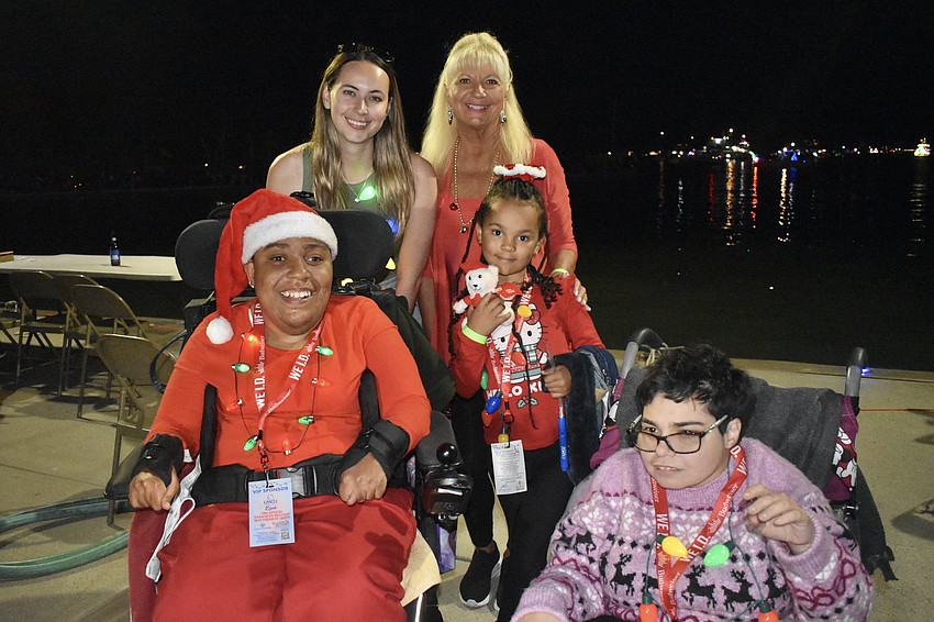 Front: Nadia McKinnon and Bri Burriss. Back: Parade co-chair Lisa Baer and Suncoast Charities for Children Executive Director Lucy Nicandri.