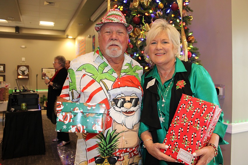 The Elks' Jerry Ditty and Meals on Wheels Plus CEO and President Maribeth Phillips work together to ensure another successful Community Holiday Shoebox Collection Drive.
