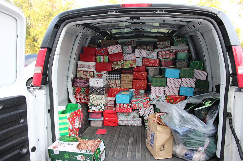 A van parked outside the Lakewood Ranch Elks Club was filling quickly with gifts for seniors during the 20th annual Community Holiday Shoebox Collection Drive and Reception Dec. 13.