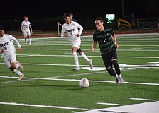 Lakewood Ranch senior forward Gabriel Lara (11) chases after the ball during a Dec. 15 game against Braden River.