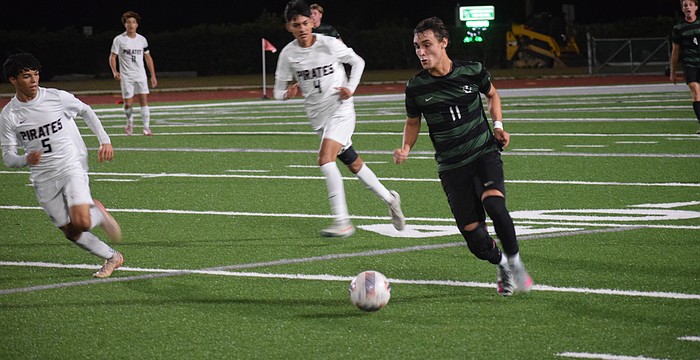 Lakewood Ranch senior forward Gabriel Lara (11) chases after the ball during a Dec. 15 game against Braden River.