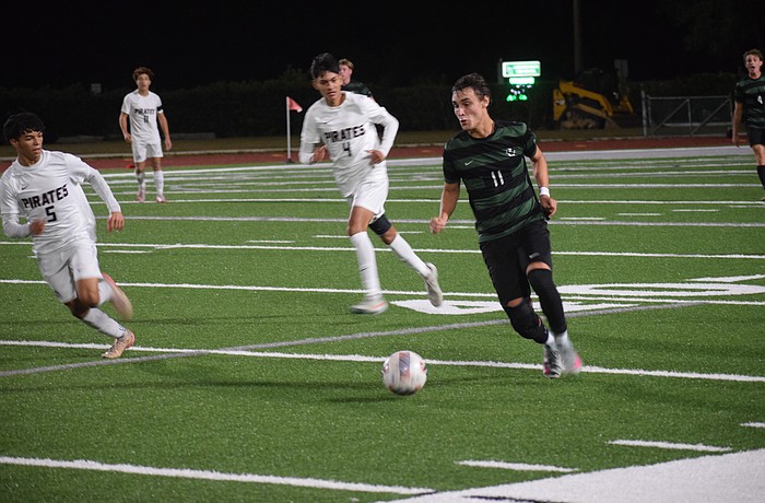 Lakewood Ranch senior forward Gabriel Lara (11) chases after the ball during a Dec. 15 game against Braden River.