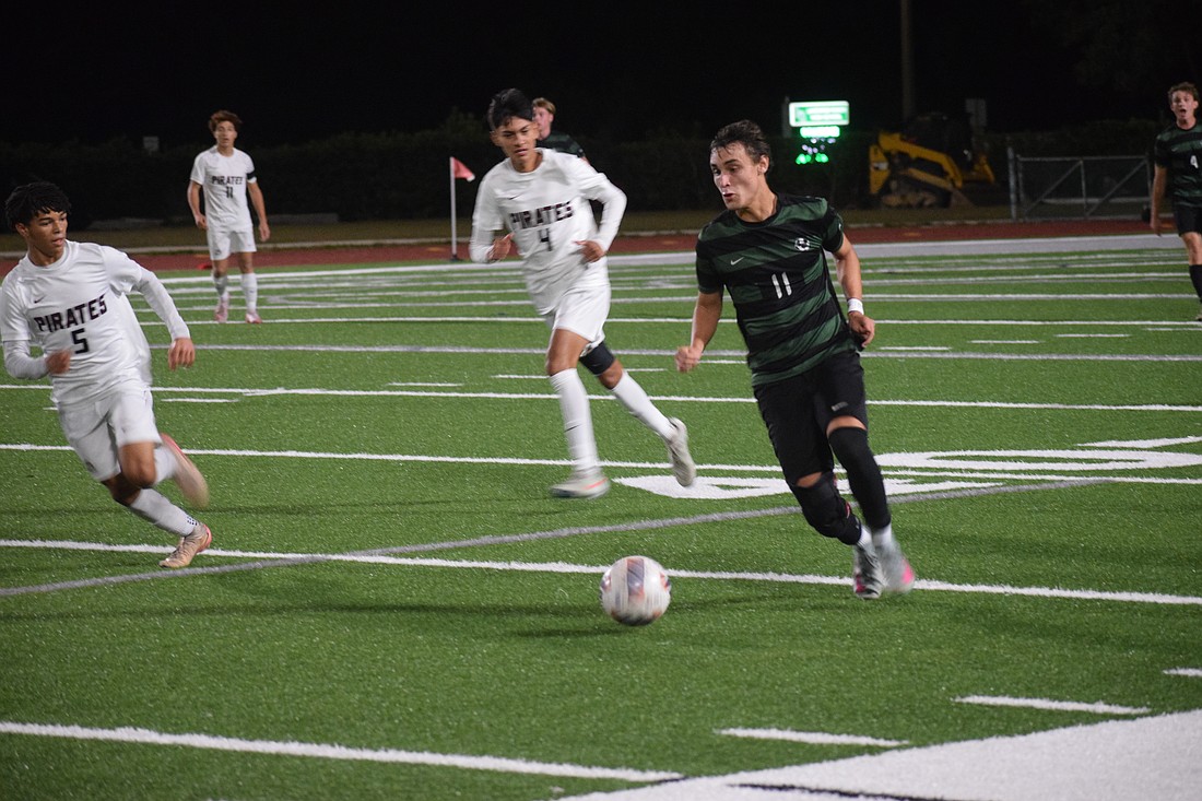 Lakewood Ranch senior forward Gabriel Lara (11) chases after the ball during a Dec. 15 game against Braden River.