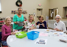 Cindy Ritchell, Ann Quackenbush, Brenda Korthauer, Beverly Sutton and Kit Torchia all lend a helping hand in packing seeds to send internationally to farmers who need them. Quackenbush is a driving force behind Hope Seeds, a charitable ministry through Christ Church of Longboat Key.