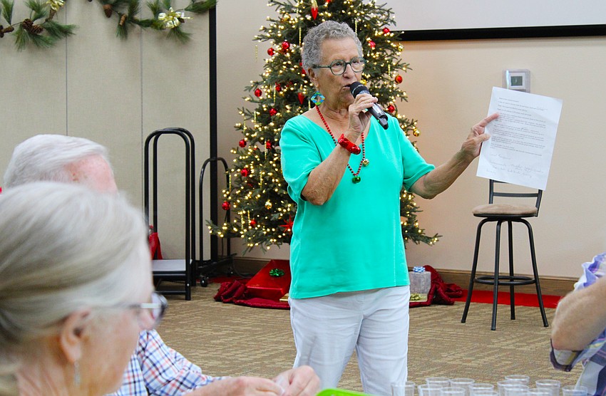 Ann Quackenbush offers updates to volunteers at the Dec. 8 seed packing event for Hope Seeds.