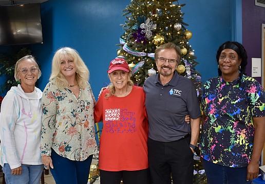 The Family Church caroling crew from left to right is Melody Johnson, Laurie Houston, Nancy Pilato, Pastor Phil Derstine and Terrial Robinson.