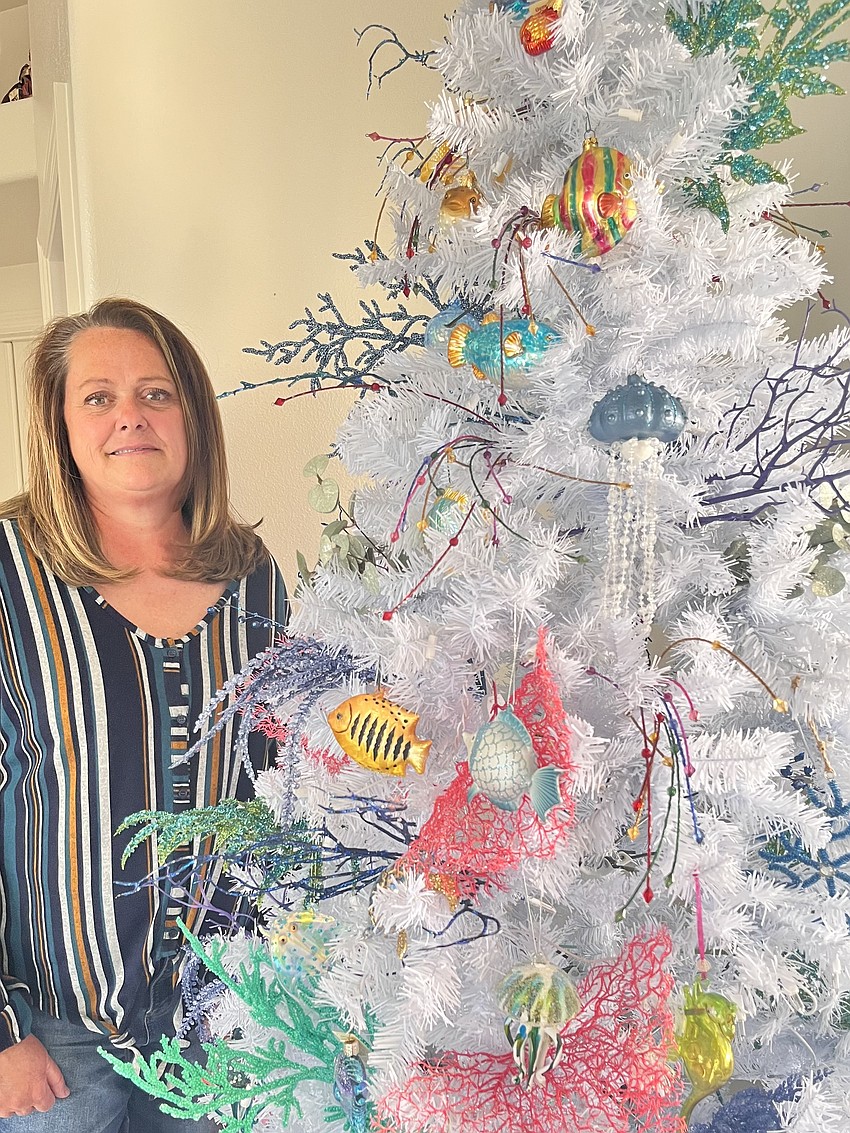 Selena Cunningham stands by her reef tree.
