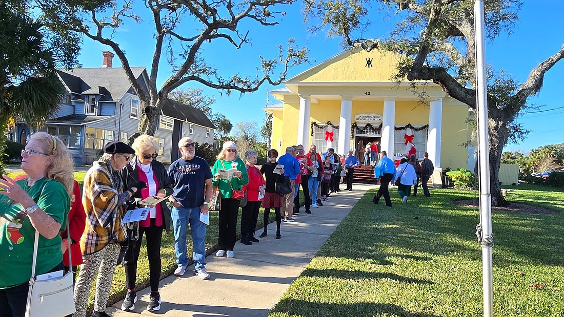 People stand in line to wait for the bus for the 18th annual Tour of Homes. Courtesy photo