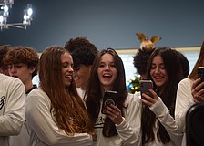 Livia Zamperlini-Ramos (left), Anna Chop (center) and Bailey Loring (right) share some joy while singing "Last Christmas."