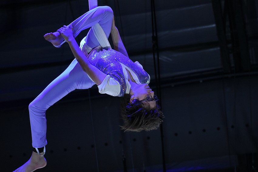 Ethan Winzeler, age 11, rehearses the aerial hammock.