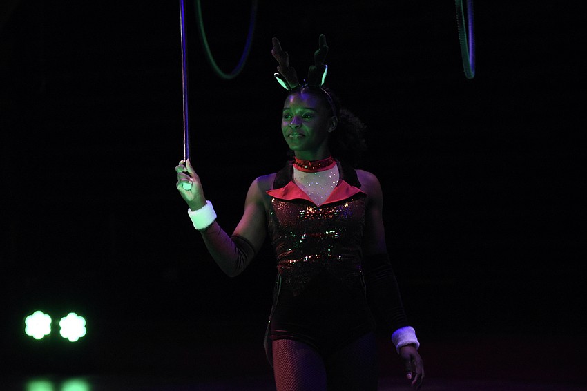 Kayla Hayes, 15, rehearses the aerial lyra as reindeer.