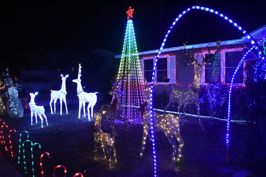 The yard was filled with figures that included reindeer and a snowman 4040 Swift Road.