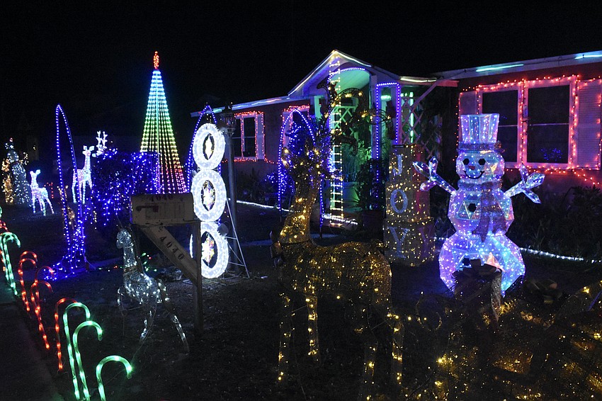 The yard was filled with figures that included reindeer and a snowman 4040 Swift Road.