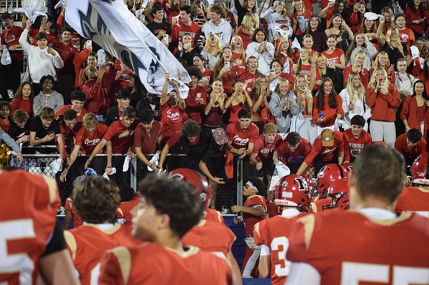 Cardinal Mooney's student section cheers following the Cougars' title-winning performance.