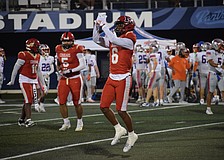LaRon Foye, a senior safety/wide receiver, points to his right ring finger following his game-sealing interception against Jacksonville Bolles.