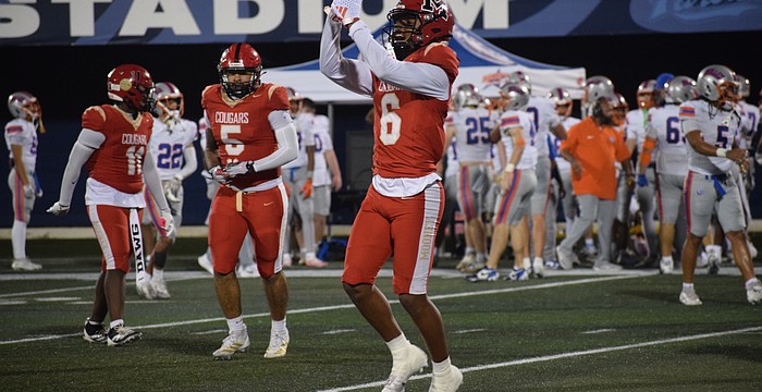 LaRon Foye, a senior safety/wide receiver, points to his right ring finger following his game-sealing interception against Jacksonville Bolles.