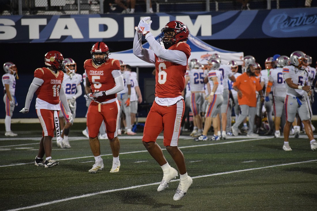 LaRon Foye, a senior safety/wide receiver, points to his right ring finger following his game-sealing interception against Jacksonville Bolles.