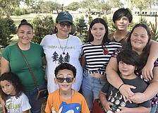 A group from Wilkinson Elementary gathers that includes Quinn Doan, 8, Elise Aponte, Jody Osceola, Jayden Doan, 4, Maya Perez, 12, Nikolas Perez, 8, Lucas Perez, 14, and Jennifer Perez.