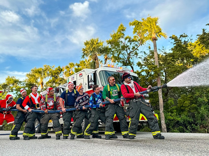 Longboat Key Fire Rescue firefighter paramedics (from left to right) Lt. Jose Rivera, Andre Hoefer, Daniel Heath, Tirso Guerrero, Chase Bullock, Trey Bowlin, Brian Kolesa, Derek Flaim and Zach Schield had some fun with a photo shoot last Christmas.