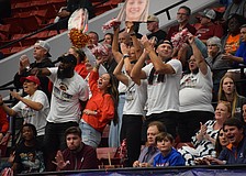 Cardinal Mooney girls basketball fans cheer from the stands at RP Funding Center in Lakeland. They witnessed the Cougars bring home the first state championship in program history last season, and now, can watch the team vie for a holiday tournament title.