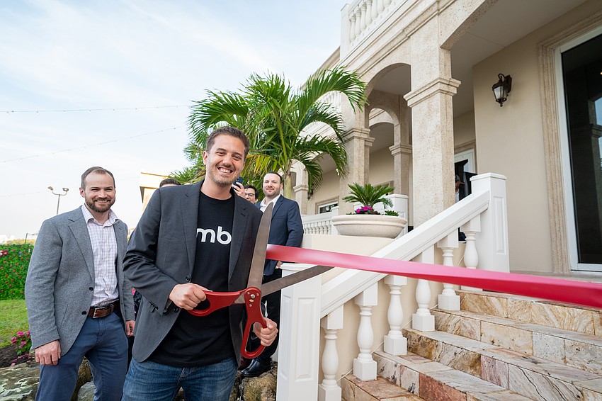 Rumble  CEO Chris Pavlovski cuts the ribbon at a grand opening party at the video platform's Longboat Key office Feb. 24, 2023.