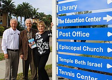 Howard Tipton, Irwin Pastor and Susan Goldfarb stand beside the newly installed sign for The Education Center on Bay Isles Road. The center starts its winter term of programs Jan. 5.
