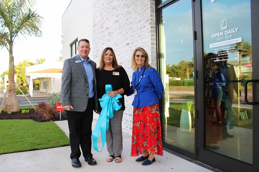 Donn Githens, Melissa Carman and Paula Peabody were happy to welcome guests to the Dec. 18 grand opening of the bookstore and donation site on Longboat Key.
