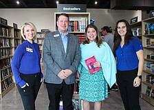 Keera Herbst, Donn Githens, Kim Verreault and Alexa Olivas help celebrate the opening of the new Longboat Key Goodwill bookstore and donation site on Dec. 18.