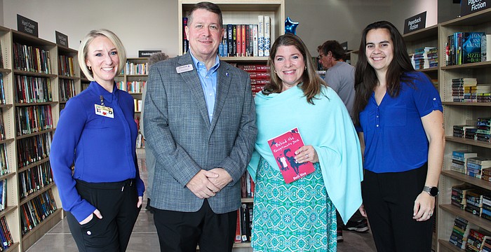 Keera Herbst, Donn Githens, Kim Verreault and Alexa Olivas help celebrate the opening of the new Longboat Key Goodwill bookstore and donation site on Dec. 18.