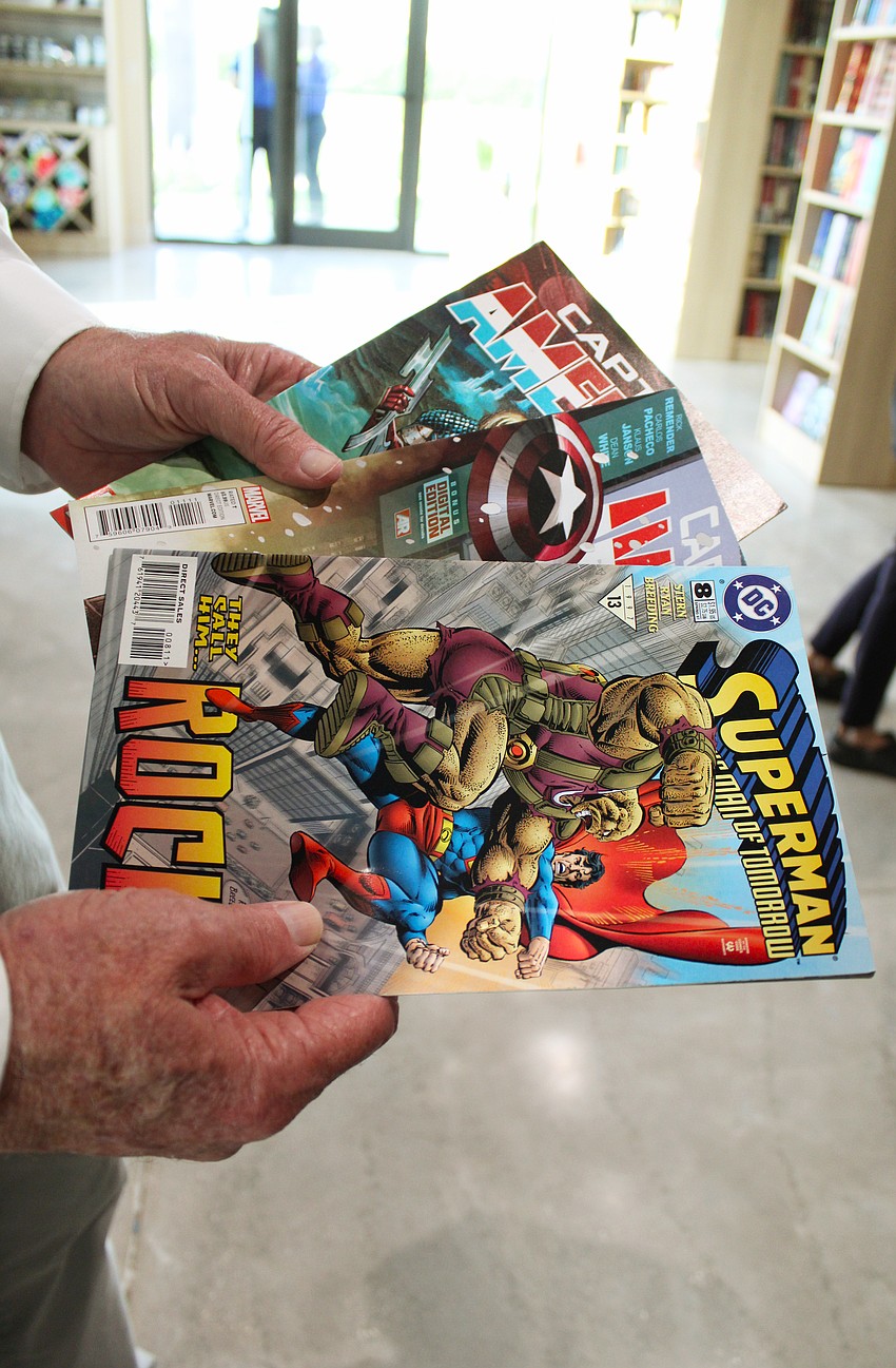 This first purchase at the Longboat Key Goodwill book store consisted of classic superhero comic books for his grandkids.