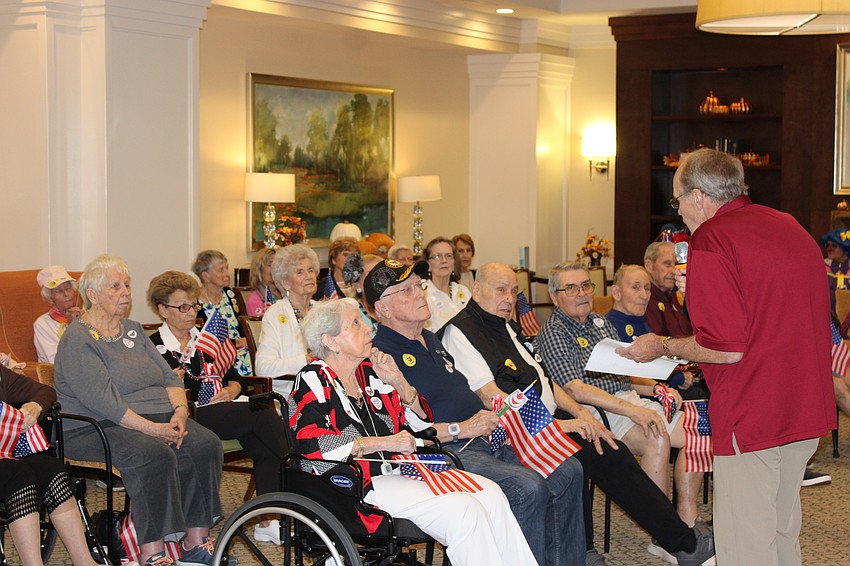 Residents at the Summit of Lakewood Ranch get ready to answer quiz questions from Knights of Columbus member John Joly.
