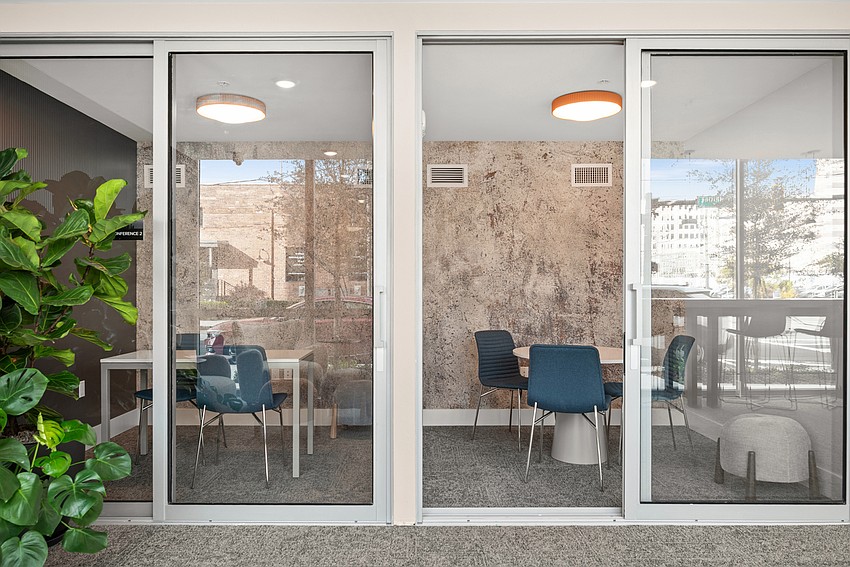 The Residences at 801 East Whiting features amenities including a coworking space. The Residences at 801 East Whiting features amenities including a coworking space.