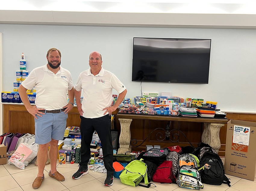 Ken Jokisch with Pastor Brett from First United Methodist at their Back to School Drive.