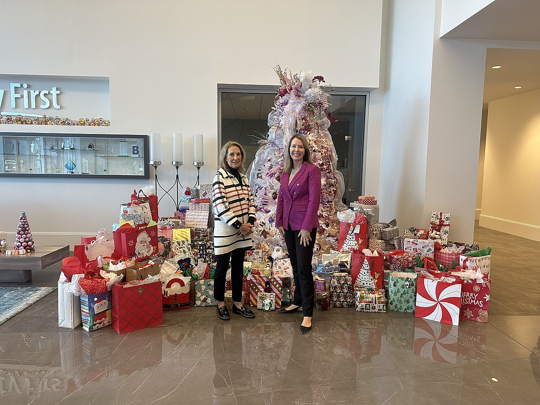 Donna Dwyer, executive assistant at Easterseals Northeast Central Florida, and Melissa Burt DeVriese, president of Security First Insurance. Courtesy photo