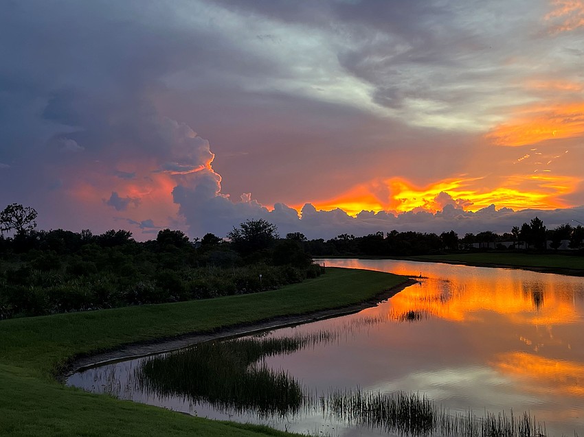 John Wotring captured this photo of a sunset reflecting on a lake in Lakewood Ranch.