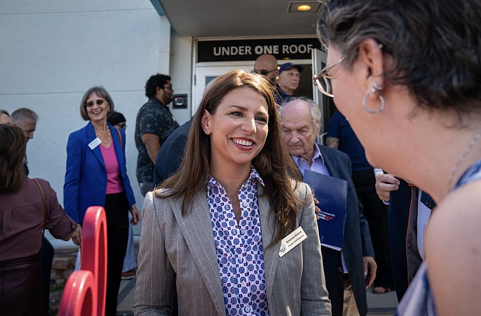 Commissioner Amanda Ballard attends the Under One Roof ribbon cutting ceremony Oct. 1. She's up for reelection in District 2.