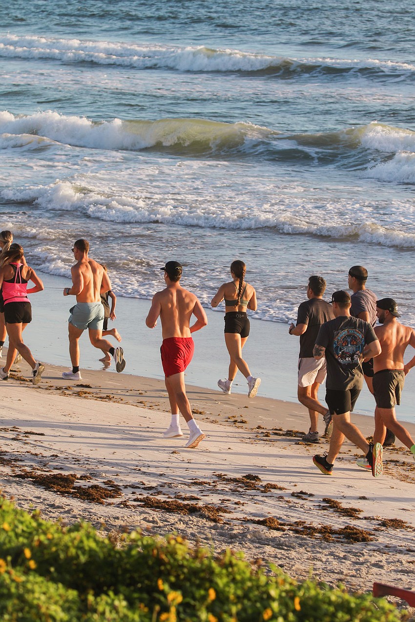 Golden Hour Run Club participants run on the beach. Courtesy photo