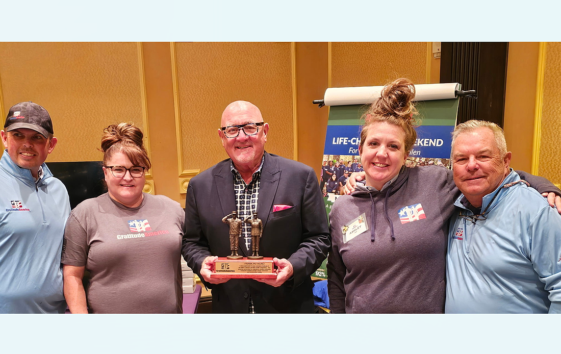 The Lori Fund donated $15,000 to GratitudeAmerica at the Golf Lunch at Hammock Beach. From left to right: Micheal Anthony, Angela Atkins, Frank Petruno, Ashley Semerneko and Stephen Gallagher. Courtesy photo