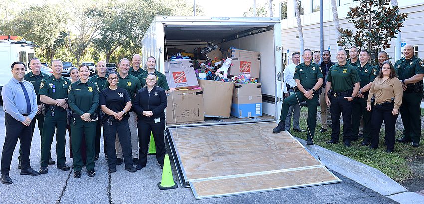 Sarasota County Sheriff's Office personnel loaded the gifts into a trailer for delivery.