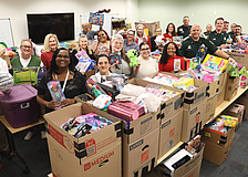 Staff at the 12th Judicial Circuit Guardian Ad Litem program sort through the delivery of presents for children up to 18 years of age.