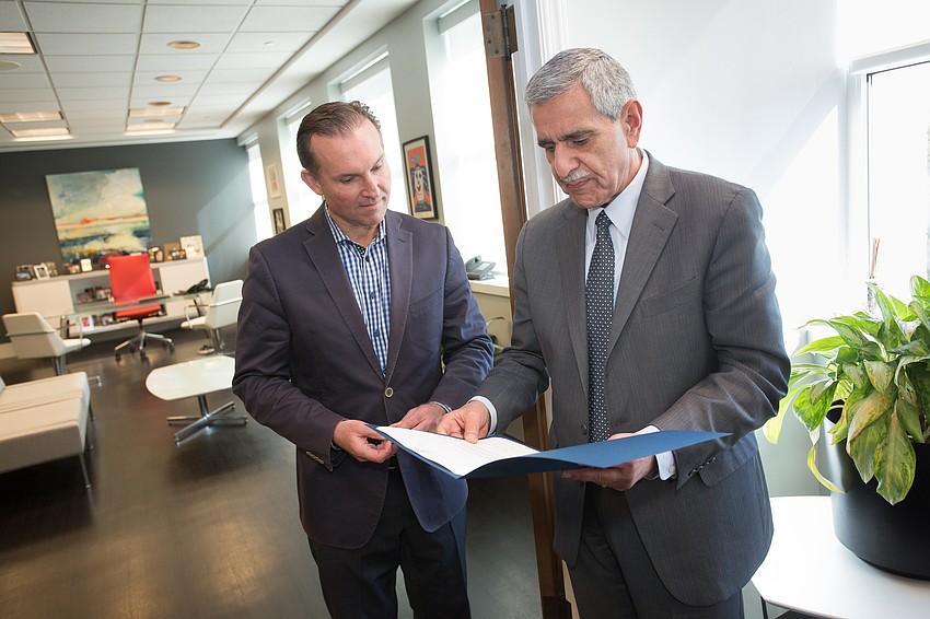 Jacksonville Mayor Lenny Curry and Sam Mousa.