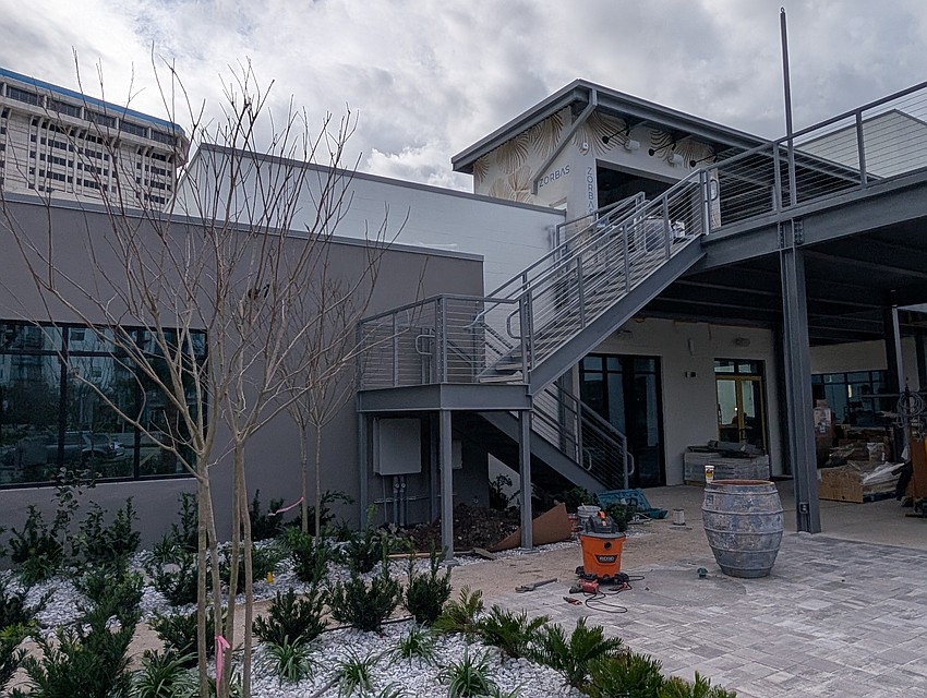 Stairs lead to the rooftop Zorba's Bar at HUB Brooklyn. Stairs lead to the rooftop Zorba's Bar at HUB Brooklyn.