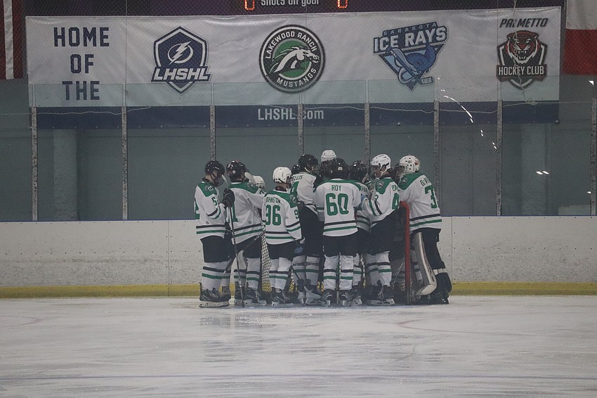 Lakewood Ranch comes together at the net before a Dec. 19 game against Jesuit at Ellenton Ice and Sports Complex. The Mustangs currently sit first in the West Conference as the last remaining undefeated team in the Lightning High School Hockey League. Lakewood Ranch comes together at the net before a Dec. 19 game against Jesuit at Ellenton Ice and Sports Complex. The Mustangs currently sit first in the West Conference as the last remaining undefeated team in the Lightning High School Hockey League.