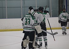 Lakewood Ranch junior goaltender James Devriendt (33) gets some postgame kudos from senior defenseman Jackson Ellis (4). Devriendt's .878 save percentage and 2.05 goals against average through 13 games are both career-best marks on a Mustangs team that has done nothing but win in 2025-26.