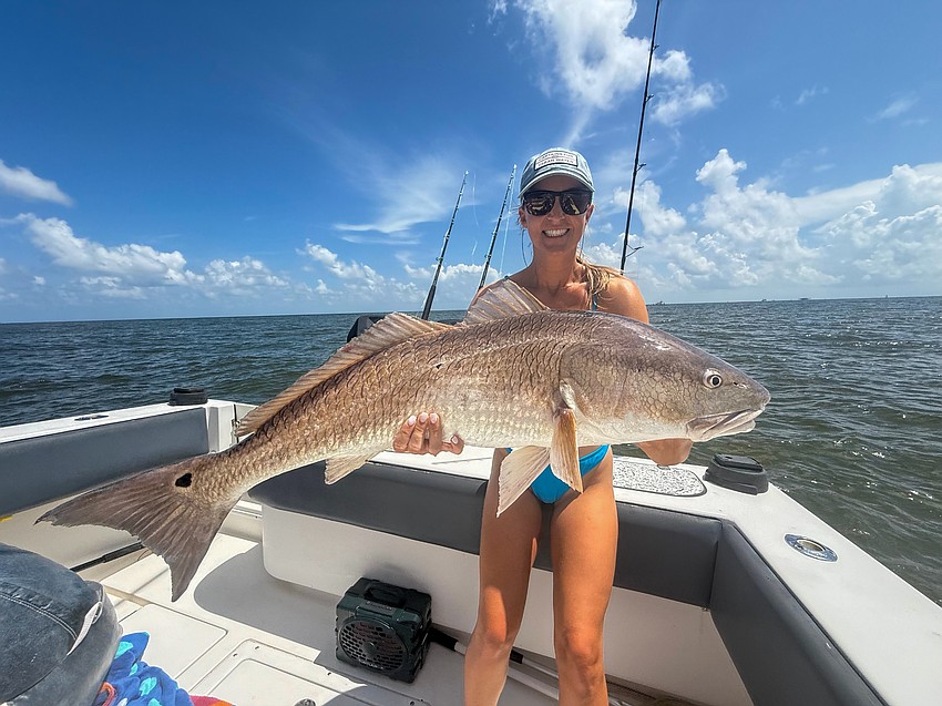 Taylor Woods with a redfish