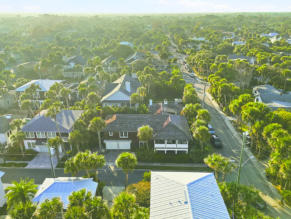 Two-story home built in 1926 features four bedrooms, four full and one half-bathrooms, butler pantry, porches, patio, outdoor kitchen and pool.