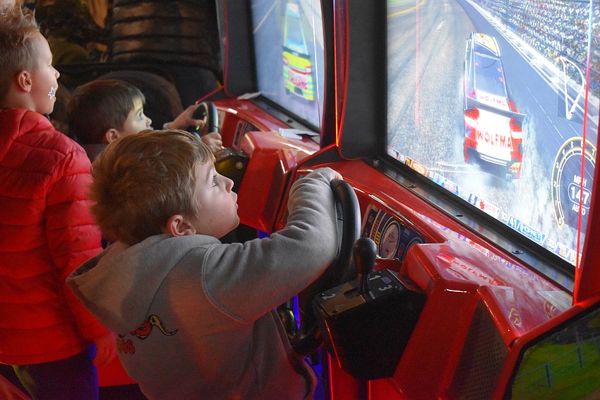 Lakewood Ranch's Vance Whitman, 6, says his favorite part of playing the racing game is shifting.